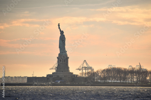 American Statue of Liberty New York Manhattan at sunset USA monument © Happy Stock