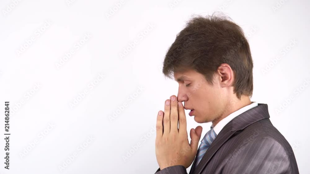 Young bearded man praying, asking God for help. Young bearded man praying, asking God for help.