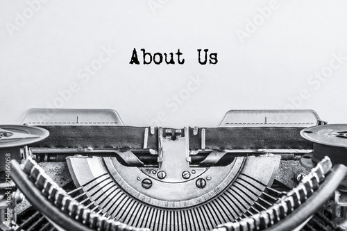 About Us, the text is typed on a vintage typewriter. ink on an old paper