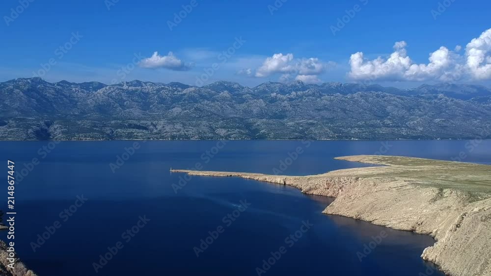 Rocky coastline with blue sea and blue sky Rocky coastline with blue sea and blue sky