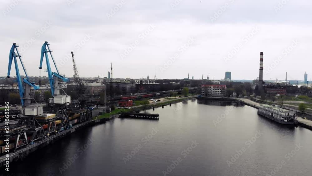Industrial port with containers. Shipping cargo to harbor by crane in export, import business and logistics. International water transportation Industrial port with containers. Shipping cargo to harbor by crane in export, import business and logistics. International water transportation
