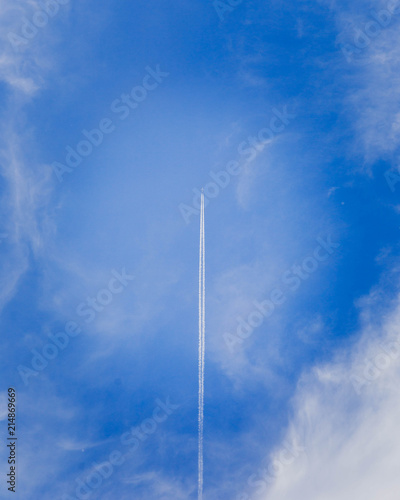 Jet in Sky With Vapor Trail (Vertical)