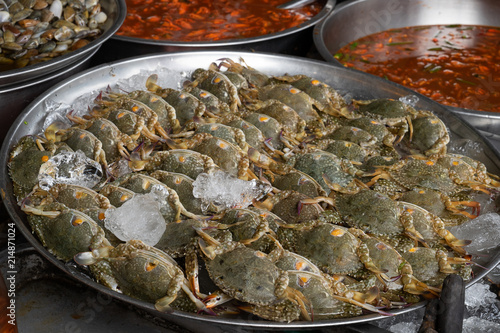 Fresh raw blue crabs from the sea ocean on ice in market or store for