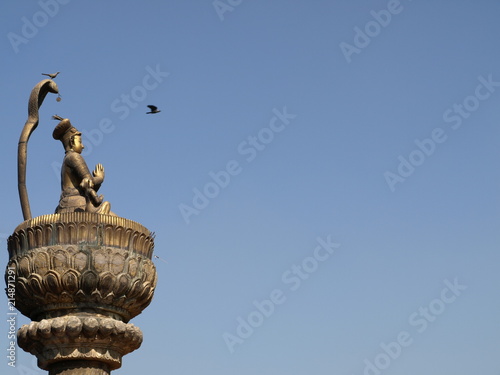 Gold pagoda and flying bird in Patan, Nepal