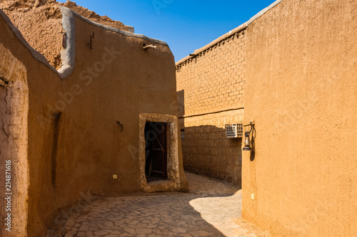 A narrow street in a traditional Arab mud brick village  Al Majmaah  Saudi Arabia
