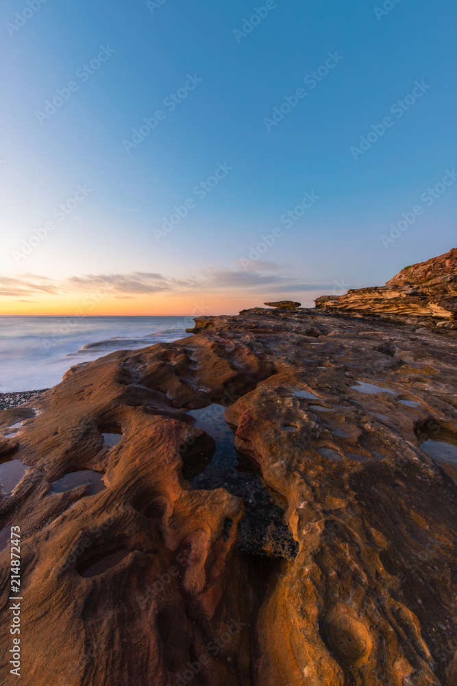 Morning golden light at rock cliff.