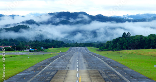Airport runway with mountain in countryside