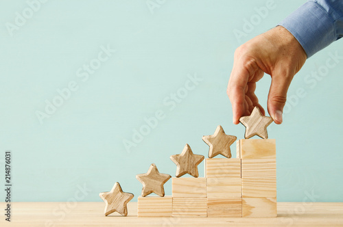 concept image of setting a five star goal. increase rating or ranking, evaluation and classification idea. photo