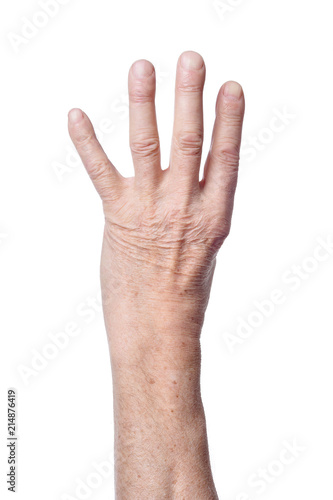 Hand of senior woman showing four fingers 