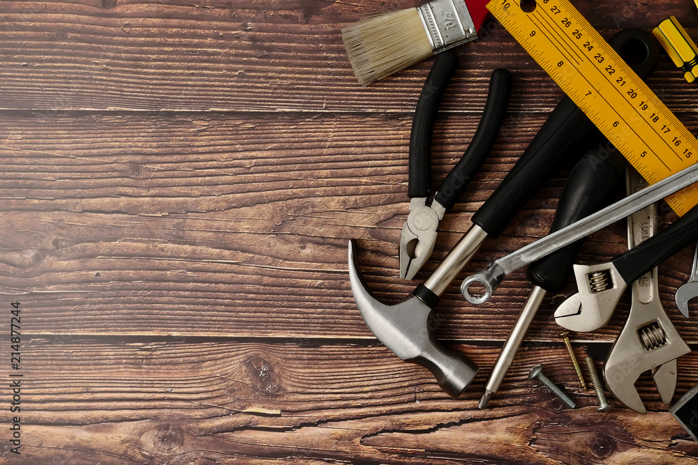 Construction worker tools on wooden table background. Free space for text Construction worker tools on wooden table background. Free space for text