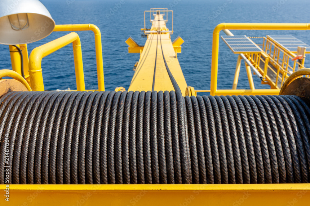Wire rope sling or cable sling on crane reel drum or winch roll of crane the lifting machine in heavy industrial Wire rope sling or cable sling on crane reel drum or winch roll of crane the lifting machine in heavy industrial