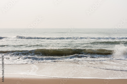 Calm waves on beach - Calm sea waves at morning time on a tropical beach.
