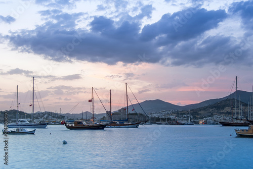 Bodrum, Turkey, 27 May 2011: Sailboats at Cove of Kumbahce on Sunset © Kayihan
