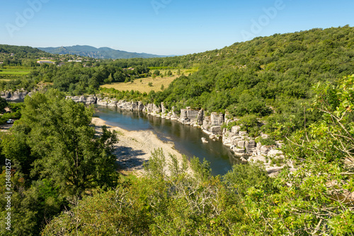 Panorama Landscape by the river Ardeche  framed by trees and gorges at  Cirque des Gens  near the small village Chauzon in the south of France