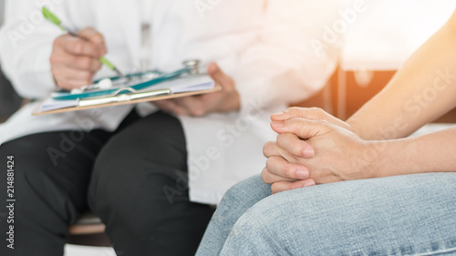 Doctor or psychiatrist consulting and diagnostic examining stressful woman patient on obstetric - gynecological female illness, or mental health in medical clinic or hospital healthcare service center