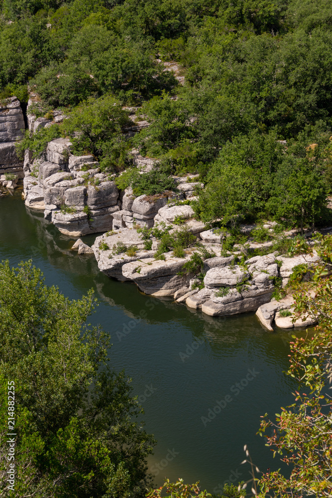 View of the river Ardeche, framed by rock faces and a lot of vegetation at 