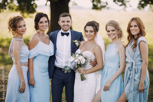 couple with bridesmaids photo