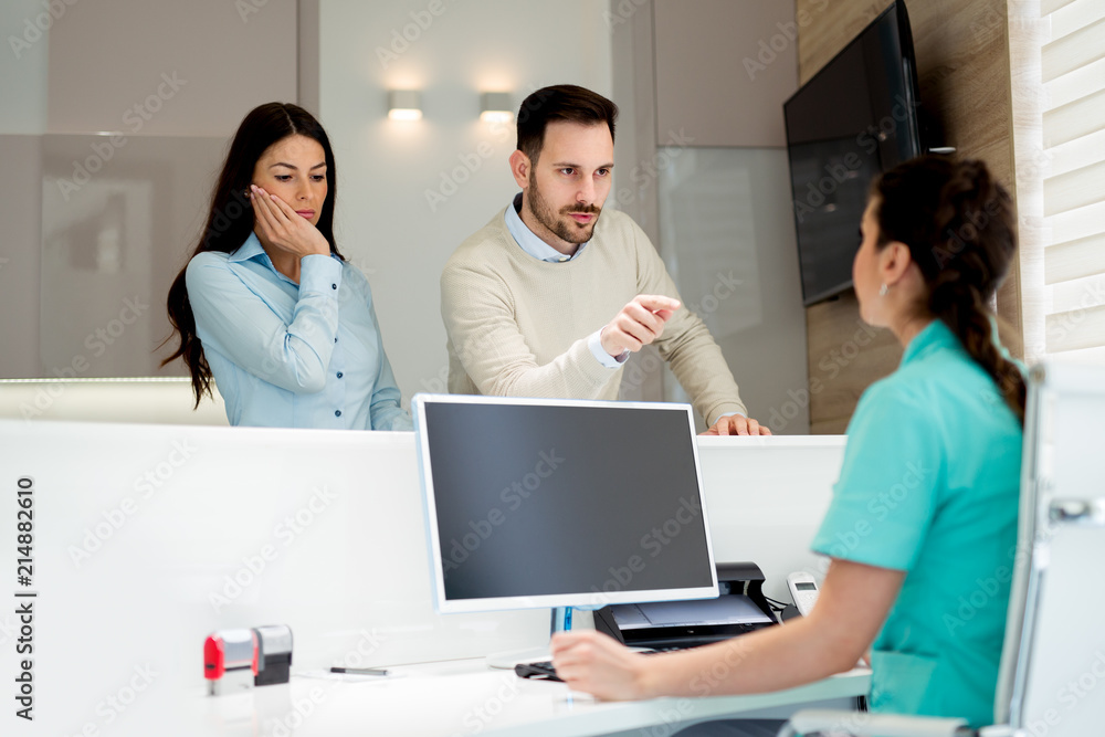 Doctors and patients speaking in the hospital waiting room