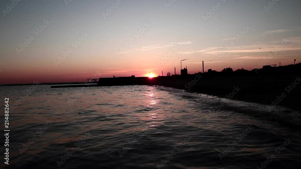 Factory and beach at sunset Factory and beach at sunset