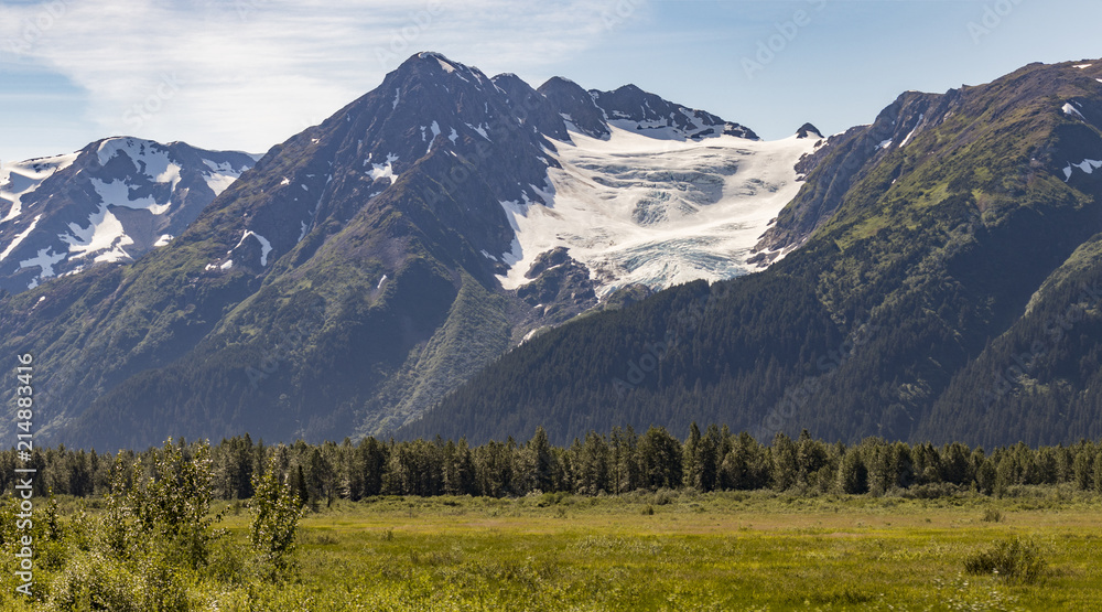 Portage Glacier, Anchorage area, against a blue sky in summertime, Alaska, USA. 
