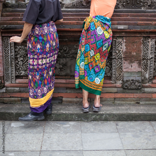 Two people from the back in temple traditional dress