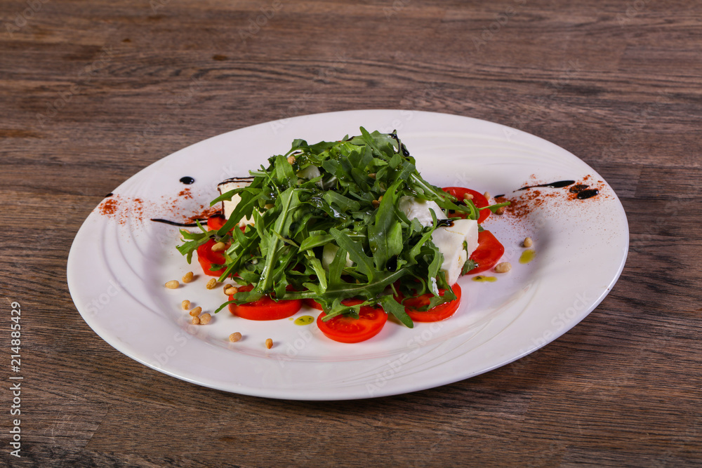 Caprese salad with arugula Caprese salad with arugula