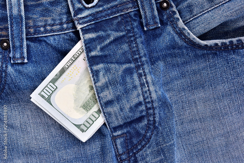 Detail of denim jeans with money. The concept of prostitution and corrupt love. sexual celebrity scandals Detail of denim jeans with money. The concept of prostitution and corrupt love. sexual celebrity scandals