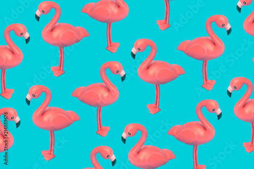 Creative pink flamingo pattern on blue background. Abstract art background. Minimal summer concept.