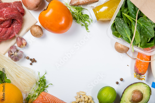 Grocery shopping concept. Balanced diet concept. Fresh foods with shopping bag on white background