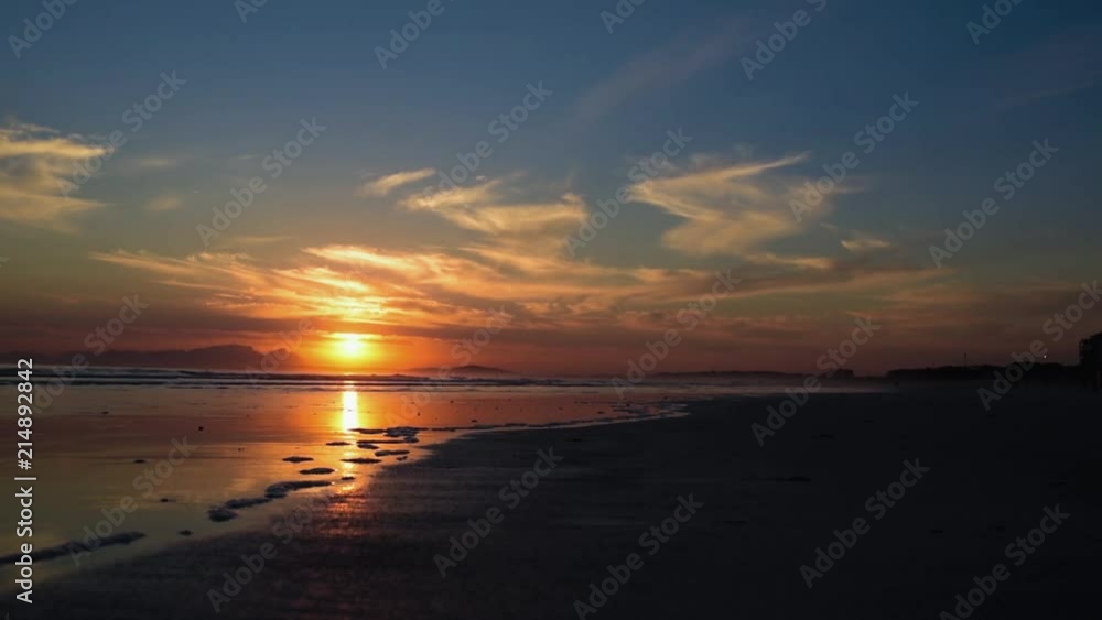 The last bit of sun of the day. Watching the sun set slowly over the ocean just behind Table Mountain, Cape Town, South Africa. The waves rolling in, the day calming down and coming to and end.
