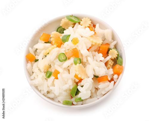 Bowl with tasty boiled rice and vegetables on white background