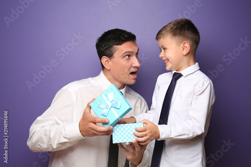 Little boy giving present t...