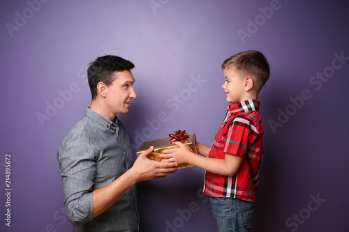 Little boy giving present t...