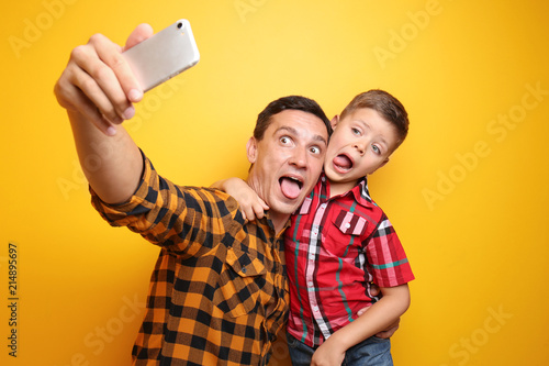 Little boy and his dad taki...