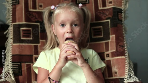 The little girl eagerly licking ice cream