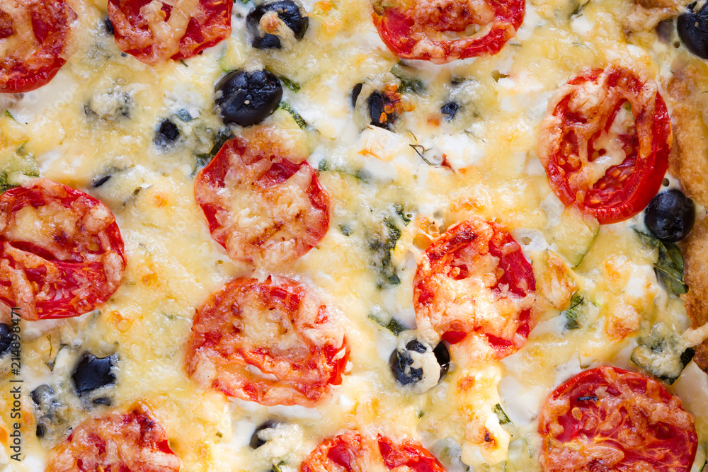 Textur of vegetarian salt pie, Quiche with tomatoes, olives and feta cheese, top view. Textur of vegetarian salt pie, Quiche with tomatoes, olives and feta cheese, top view.
