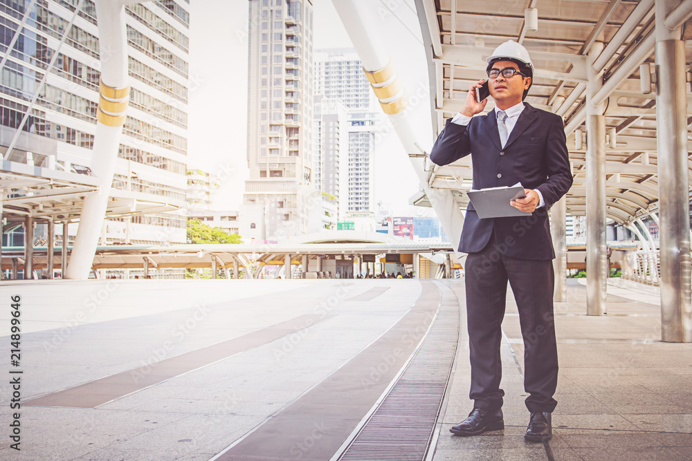Businessman planning construction project Businessman planning construction project
