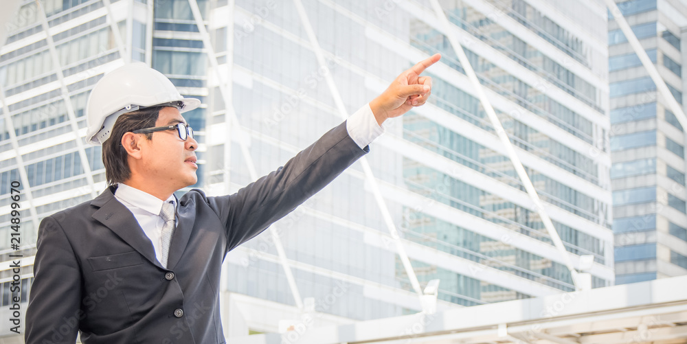 Businessman planning construction project Businessman planning construction project