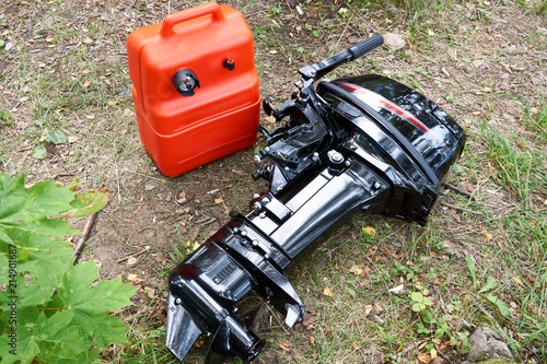 Fototapeta Naklejka Na Ścianę i Meble -  Boat motor and canister with gasoline