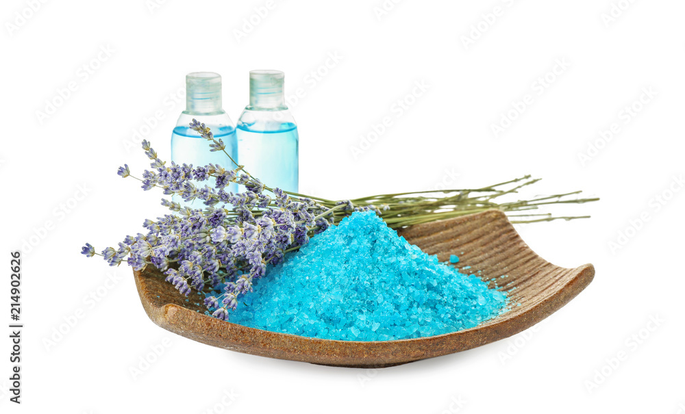 Obraz premium Plate with sea salt, cosmetics for spa procedures and beautiful lavender on white background