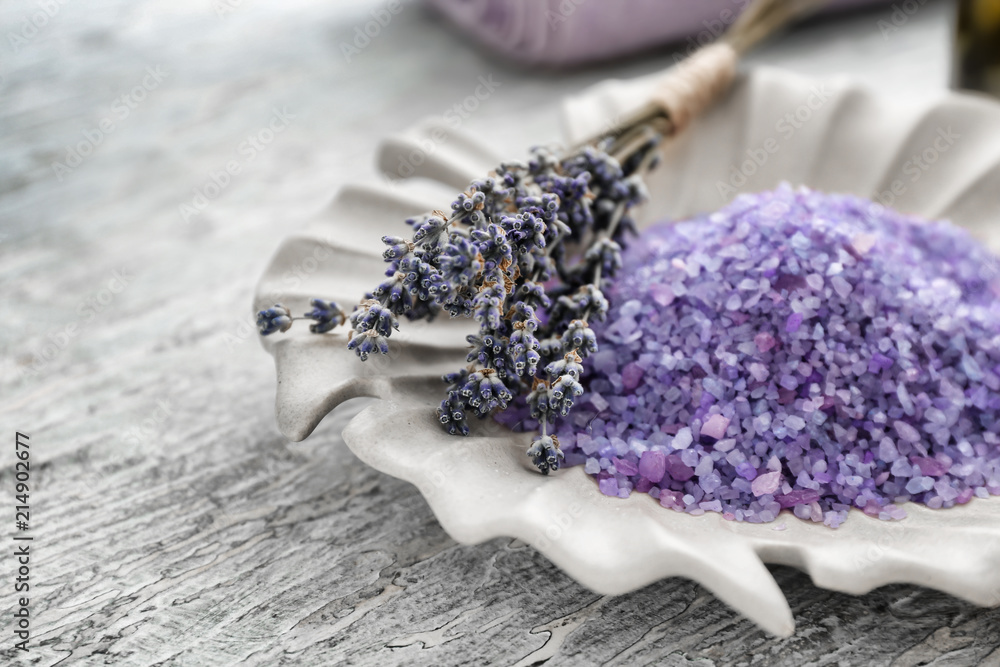 Plate with beautiful lavender and sea salt on wooden table, closeup Plate with beautiful lavender and sea salt on wooden table, closeup