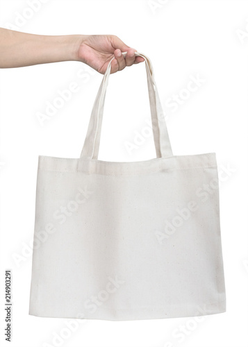 Tote bag canvas cotton fabric cloth for eco shopping sack mockup blank template isolated on white background (clipping path) with woman’s handling hand