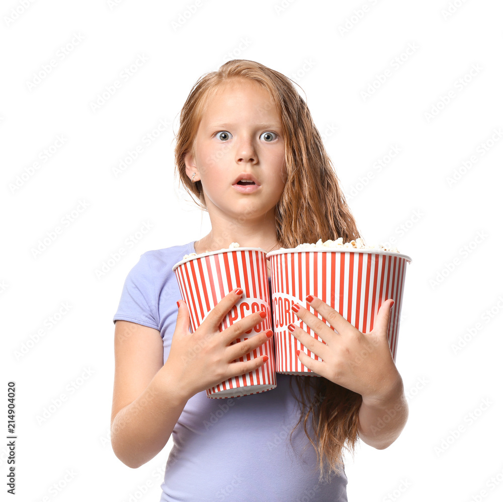 Emotional little girl with cups of popcorn watching movie on white background Emotional little girl with cups of popcorn watching movie on white background