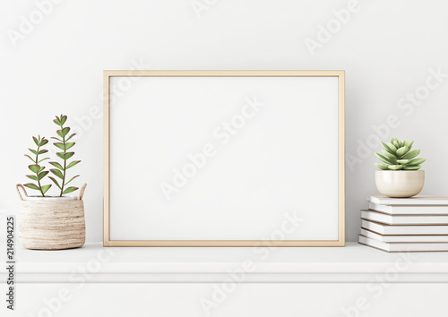 Home interior poster mock up with horizontal metal frame, succulents in basket and pile of books on white wall background. 3D rendering.