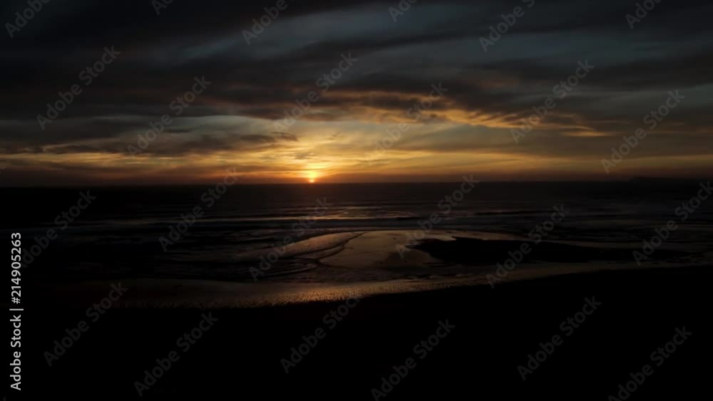 A time-lapse of the sun setting over the ocean. A time-lapse of the sun setting over the ocean.