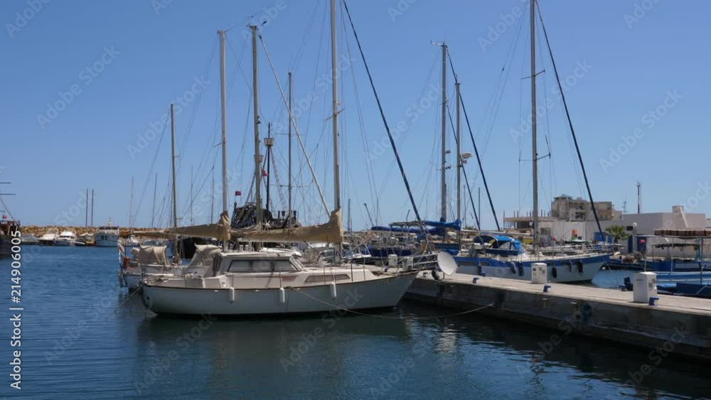 Seascape view with yachts and ships in marina port on sunny day Seascape view with yachts and ships in marina port on sunny day