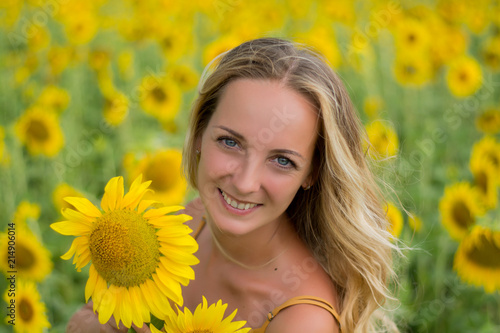 Happy woman with sunflowers. The girl in the fields of a sunflower