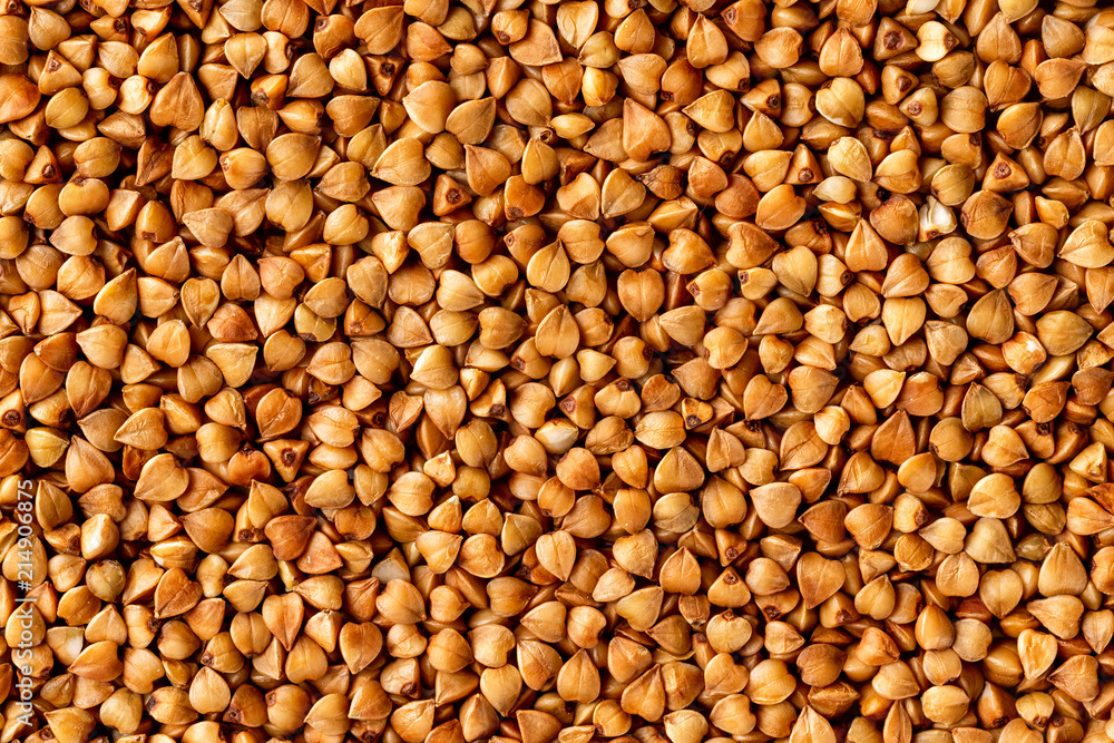 Macro image of buckwheat grain as a natural vegan food background. Macro image of buckwheat grain as a natural vegan food background.