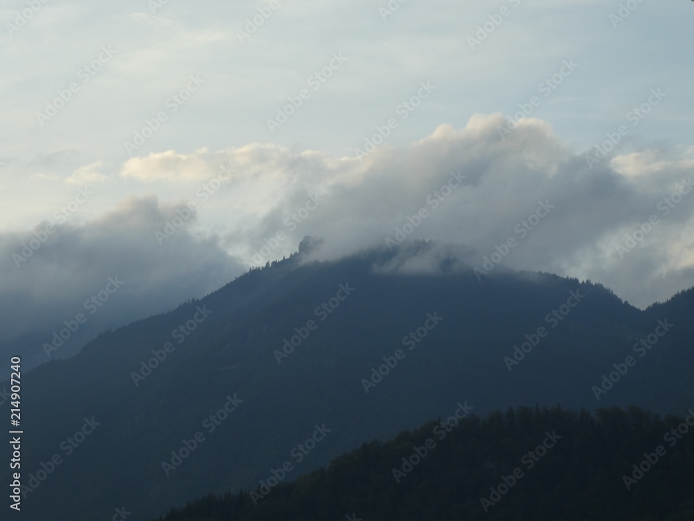 Landscape of the mountains in austria summit rock fog clouds