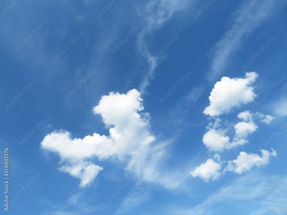 Blue sky with white cumulus and cirrus clouds in sunny day. Clouds as beautiful weather background Blue sky with white cumulus and cirrus clouds in sunny day. Clouds as beautiful weather background